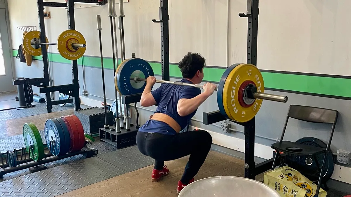 A member squatting at Chicago Strength & Conditioning