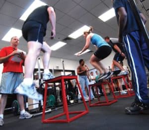 Athlete performing a barbell deadlift during a fitness workout