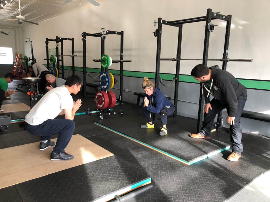 David Abdemoulaie teaching the barbell squat